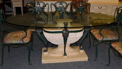 Lot 1010 - An Egyptian Revival Dining Table of recent date, with an oval glass top above caryatid supports and