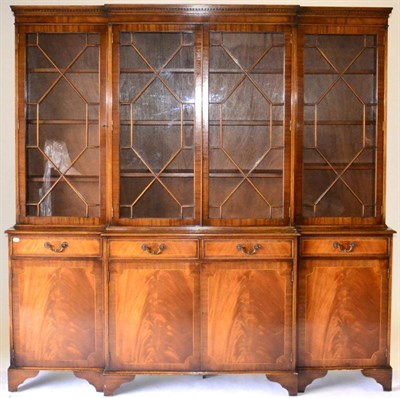 Lot 1012 - A Reproduction Mahogany Crossbanded and Boxwood Strung Breakfront Bookcase, the upper section...