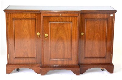 Lot 1015 - A Reproduction Mahogany Breakfront Sideboard, with plate glass top above a pull-out slide with...