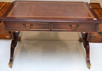 Lot 1017 - A Reproduction Mahogany Writing Table, in Regency style, with brown leather writing surface...