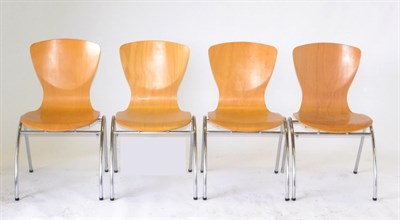 Lot 1024 - Four Beech and Chrome Tubular Stacking Chairs of recent date, 44cm by 46cm by 85cm