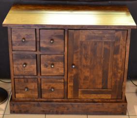 Lot 1031 - A Reproduction Hardwood Chest, six small drawers flanked by a cupboard raised on a plinth base,...