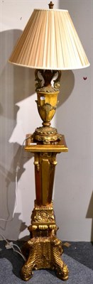 Lot 1033 - A Gilt Composition Torchère of recent date, the platform top above a tapering support,...