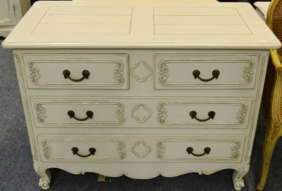 Lot 1035 - A Cream Painted Four Drawer Commode of recent date, two short over two long drawers, above a...
