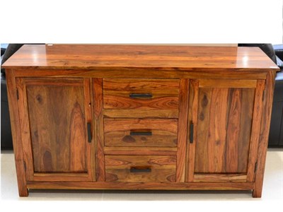 Lot 1050 - A Hardwood Sideboard of recent date, three drawers flanked by cupboard doors, 150cm by 48cm by 83cm