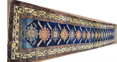 Lot 833 - Narrow Serabend Runner West Persia The deep indigo field with a single column of skeletal...