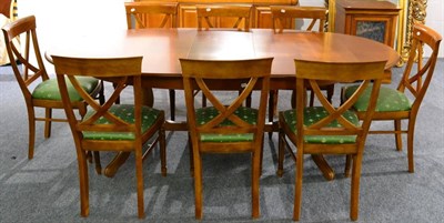 Lot 1059 - An Eleven Piece Reproduction Cherrywood Dining Suite, comprising oval extending dining table, 181cm