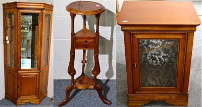 Lot 1060 - A Reproduction Cherrywood Free-Standing Corner Cupboard, with bevelled glass panels enclosing glass
