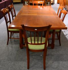 Lot 1068 - A Reproduction Cherrywood Extending Dining Table, the rectangular cleated top raised on gun...