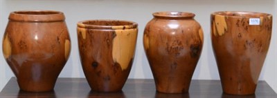 Lot 1076 - Terry Harvey: Four Burr Yewwood Vases, made from the same tree in Lancaster, circa 2008, each...