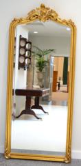Lot 1091 - A Gilt Composition Mirror in the Victorian style, of recent date, bevel glass mirror plate within a