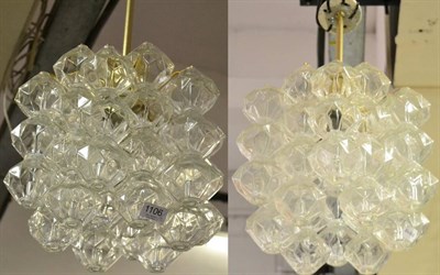 Lot 1106 - A Pair of 20th Century Glass Chandeliers, of faceted form, maximum drop 55cm