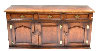 Lot 1115 - A Titchmarsh & Goodwin Oak Sideboard or Dresser Base, model RL19855/C, three drawers above...