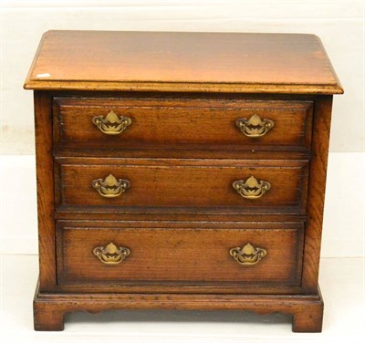 Lot 1119 - A Titchmarsh & Goodwin Oak Low Cabinet with a faux drawer over two graduated drawers