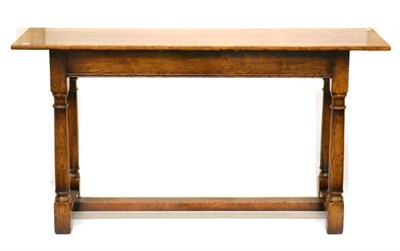 Lot 1123 - A Titchmarsh & Goodwin Reproduction Oak Hall Table, the rectangular top above a plain frieze,...