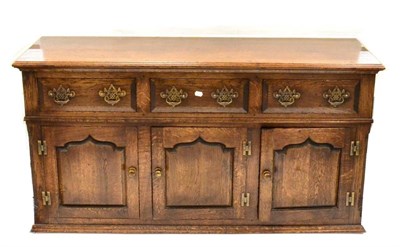 Lot 1125 - A Titchmarsh & Goodwin Oak Sideboard of recent date, with three frieze drawers above three...