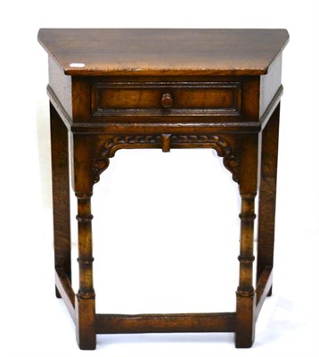 Lot 1130 - A Titchmarsh & Goodwin Style Reproduction Oak Hall Table, of canted form with single frieze drawer