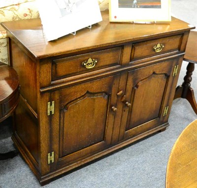 Lot 1131 - A Titchmarsh & Goodwin Oak Dresser Base, with two frieze drawers above two fielded cupboard...