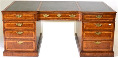 Lot 1140 - Arthur Brett & Sons, Norwich: A Reproduction Walnut and Feather Banded Partners' Desk of recent...