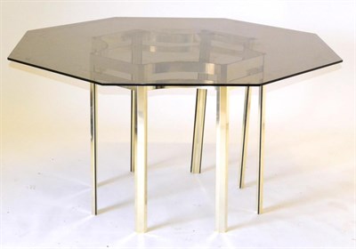 Lot 1150 - A 1970s Smoked Glass Hexagonal Shaped Dining Table, raised on a metal tubular frame with square...