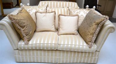 Lot 1163 - A Modern Knole Type Sofa, upholstered in cream striped fabric, with drop ends and three scatter...