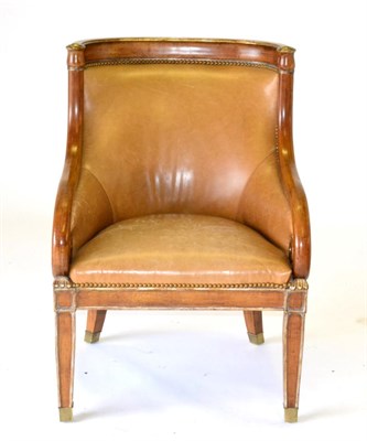 Lot 1173 - A Reproduction Brown Leather and Close-Nailed Armchair, in Regency style, with curved back support