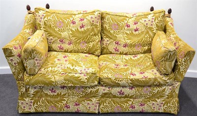 Lot 1176 - A Feather-Filled Knole Style Sofa of recent date, upholstered in gold leaf pink floral design...