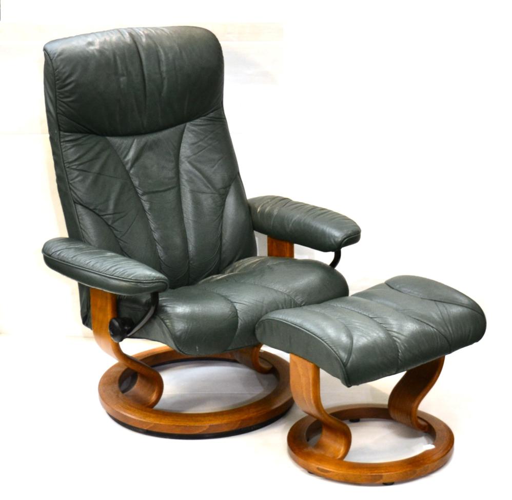 Lot 1177 - An Ekornes Green Leather Stressless Revolving Armchair, 76cm by 50cm by 100cm; and A Matching...