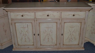 Lot 1006 - An Italian Style Cream Painted Sideboard, of recent date, with three frieze drawers above three...