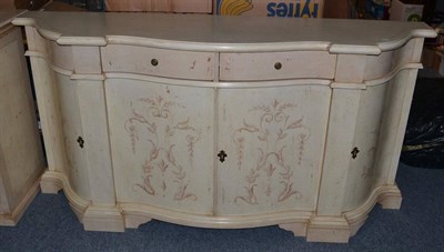 Lot 1008 - An Italian Style Cream Painted Credenza, of serpentine shaped form, with two frieze drawers...