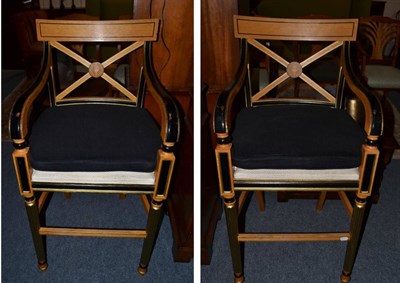 Lot 1011 - A Pair of Regency Style Beech, Ebonised and Parcel Gilt High Chairs, with black squab cushions,...