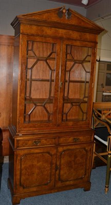Lot 1028 - A Reproduction Pollard Oak Bookcase, in George III style, the architectural pediment above astragal