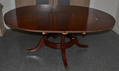 Lot 1032 - A Reproduction Mahogany Jupe Style Dining Table, inlaid with an oak and ebony sun burst emblem with