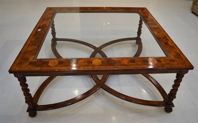 Lot 1034 - A Walnut and Oyster Veneered Coffee Table, of recent date, the moulded frame with plate glass...
