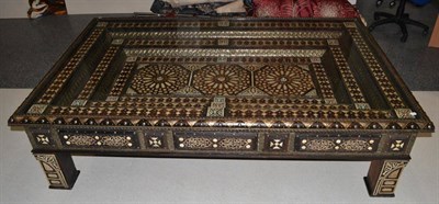 Lot 1043 - A Moroccan Style Coffee Table, of massive proportions, decorated overall with geometic...