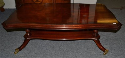 Lot 1047 - A Charles Barr Reproduction Mahogany Serpentine Shaped Coffee Table, with quarter veneered and...