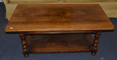 Lot 1055 - A Titchmarsh & Goodwin Oak Coffee Table, the plank top above spindle turned supports joined by...