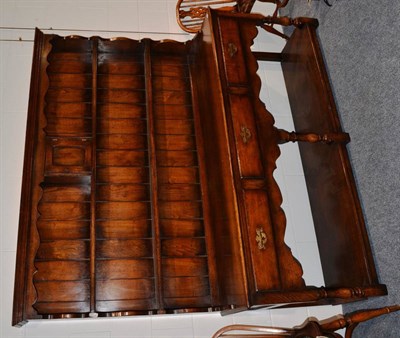 Lot 1058 - A Titchmarsh & Goodwin Oak Dresser, in George III style, the rack with two shelves and a small...