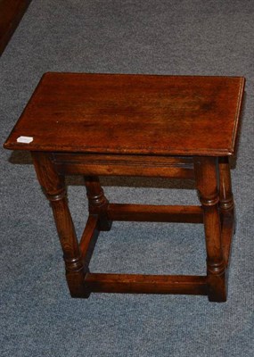 Lot 1060 - A Titchmarsh & Goodwin Oak Joint Stool or Side Table, of rectangular form, raised on gun barrel...