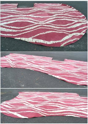 Lot 1068 - A Bespoke Pink Ground Carpet, of recent date, of serpentine shaped form and cut to fit around a...