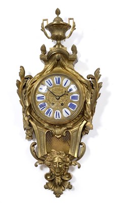 Lot 918 - A Large Ormolu Striking Cartel Wall Clock, circa 1890, surmounted with an urn, swag and scroll...