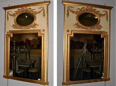 Lot 1105 - A Pair of Victorian Style Cream and Gilt Painted Mirrors, the rectangular mirror plate within...