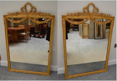Lot 1108 - A Pair of Gilt Mirrors, of recent date, the rectangular moulded frames with flowerbell swags...