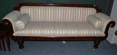 Lot 1126 - A Victorian Mahogany Framed Scroll End Sofa, recovered in cream striped fabric with rounded...