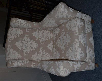 Lot 1133 - A Chatsworth Wing Back Armchair, of recent date, upholstered in beige and cream fabric with rounded