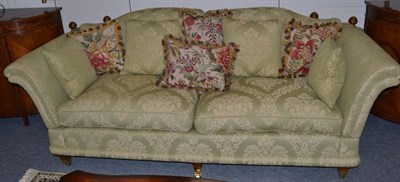 Lot 1141 - A Green Floral Patterned Knole Style Sofa, of recent date, with four feather-filled squab...