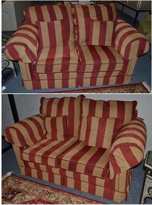 Lot 1144 - A Pair of Two-Seater Sofas, of recent date, upholstered in red and beige striped fabric with...