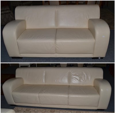 Lot 1145 - A Pair of Cream Leather Sofas, of recent date, comprising a three-seater sofa with rounded arms and