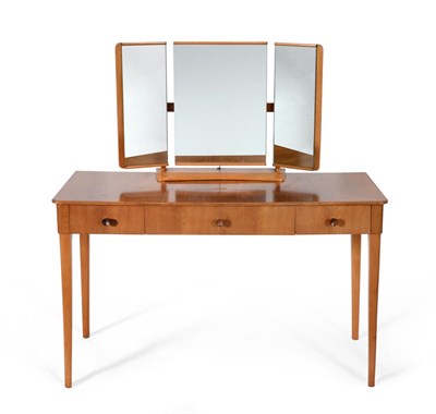 Lot 1154 - A Gordon Russell Walnut Dressing Table, with a triptych threefold mirror, with a sliding drawer...