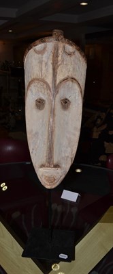 Lot 1197 - A Fang Ngil Large White Painted Mask, 80cm high